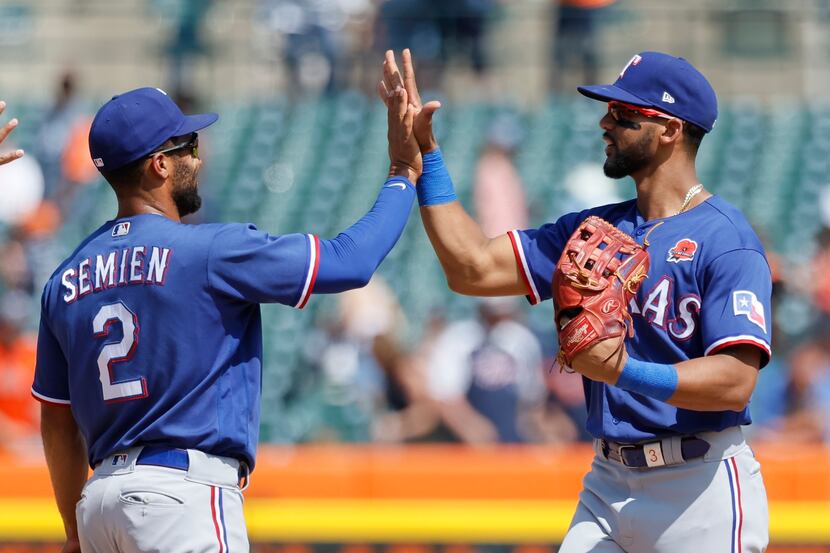 Texas Rangers' Marcus Semien (2) celebrates with Leody Taveras after a win over the Detroit...