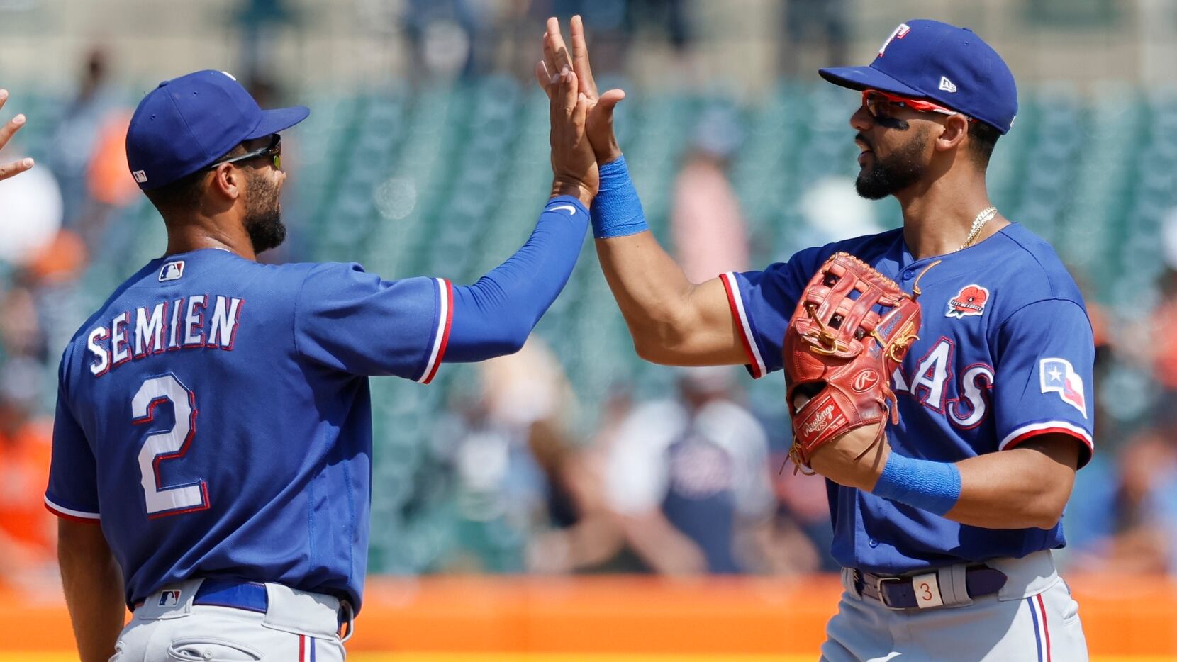 Texas Rangers' Marcus Semien (2) celebrates with Leody Taveras after a win over the Detroit...