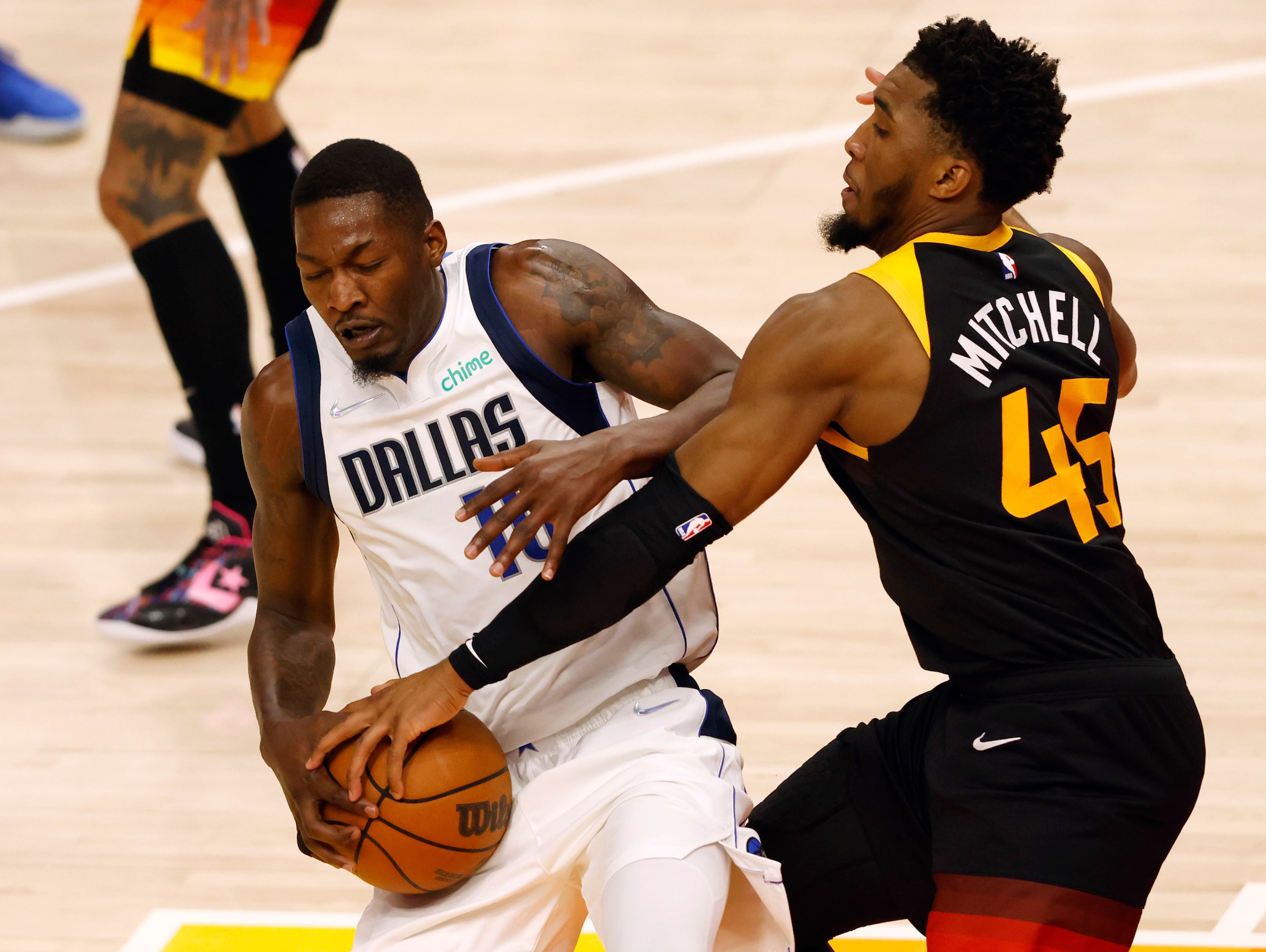 Utah Jazz guard Donovan Mitchell (45) gets his hands on the ball as Dallas Mavericks forward...