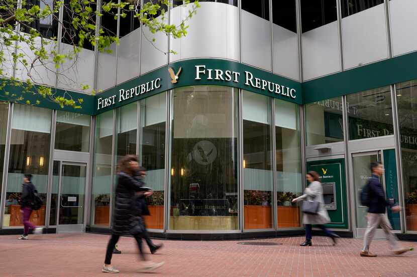 Pedestrians walk past the headquarters of First Republic Bank in San Francisco on May 1.