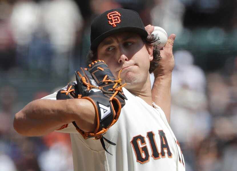 San Francisco Giants pitcher Derek Holland throws against the New York Mets during the...