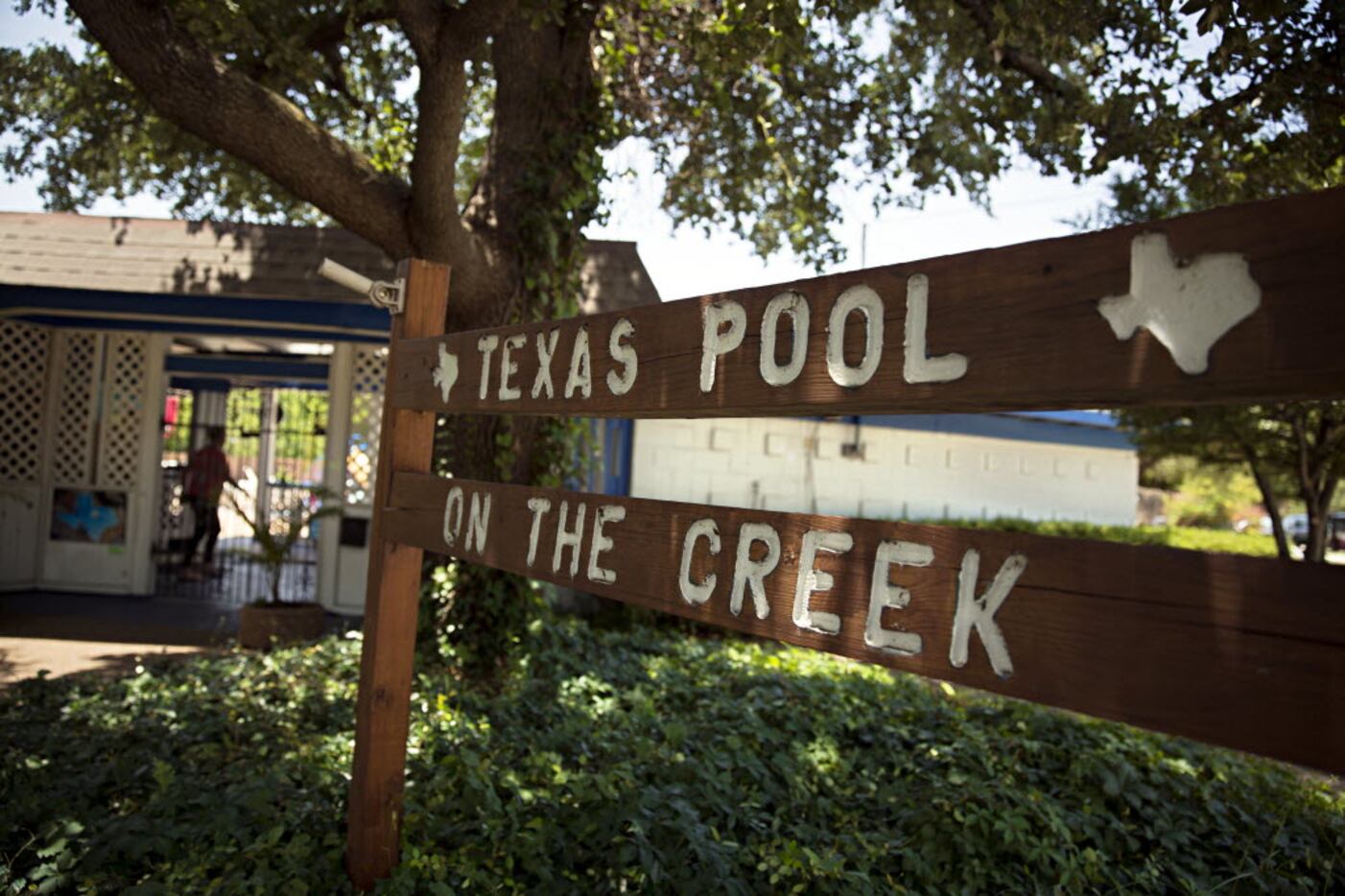 A handmade sign welcomes visitors to the Texas Pool on June 30, 2015, in Plano.