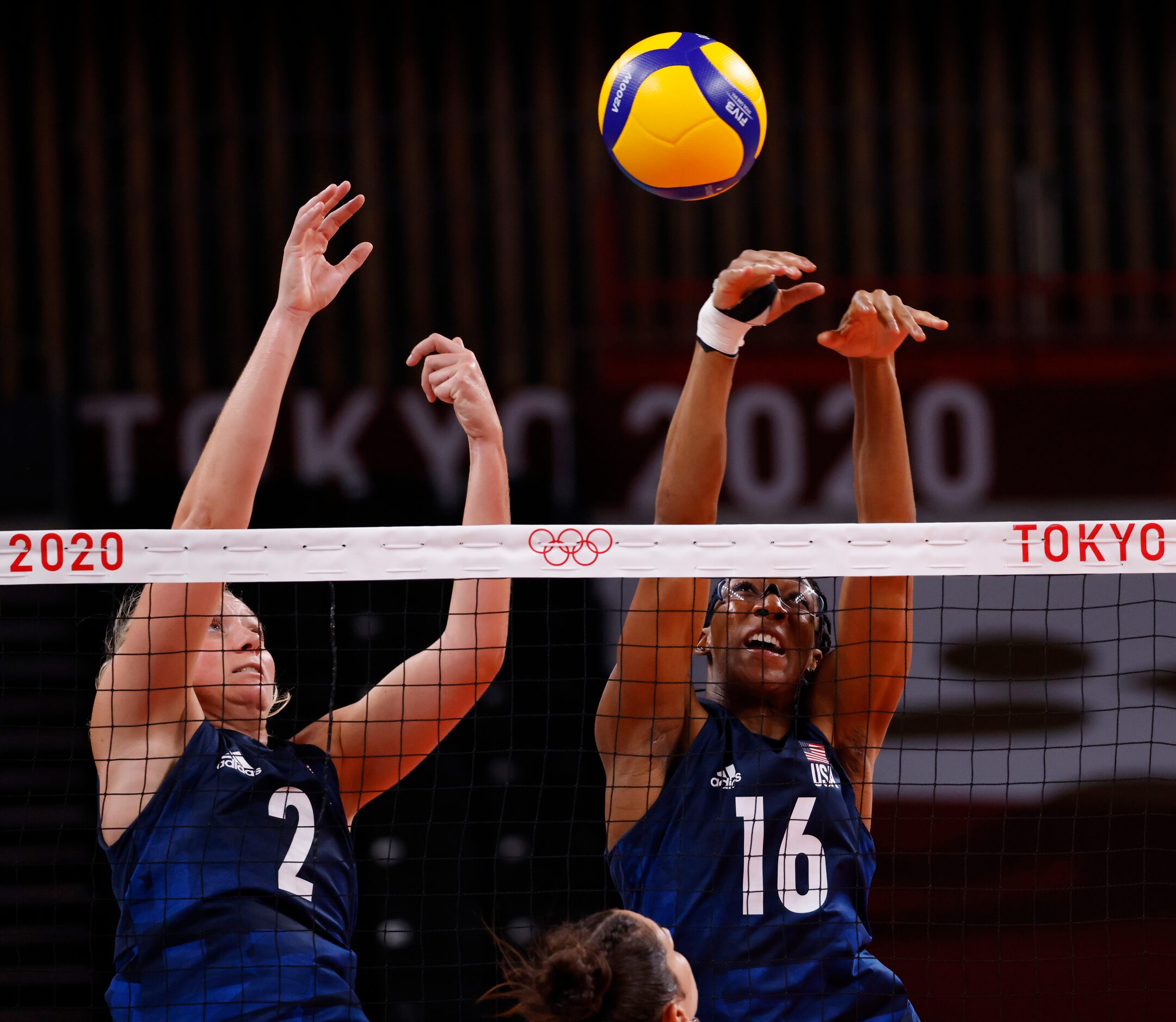 USA’s Jordyn Poulter (2) and Foluke Akinradewo (16) block a ball hit by Argentina’s Julieta...