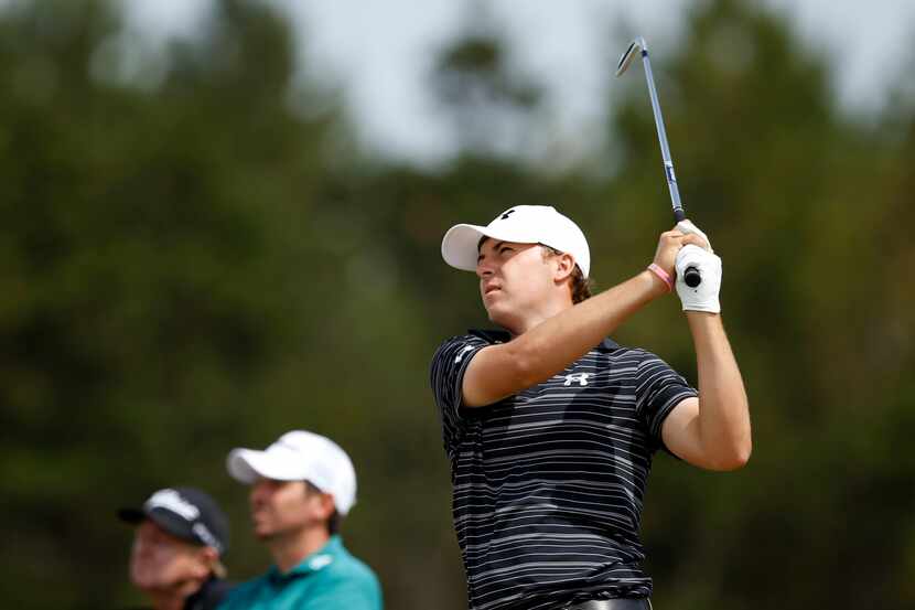 Jordan Spieth of the United States plays a shot off the 7th tee during a practice round...