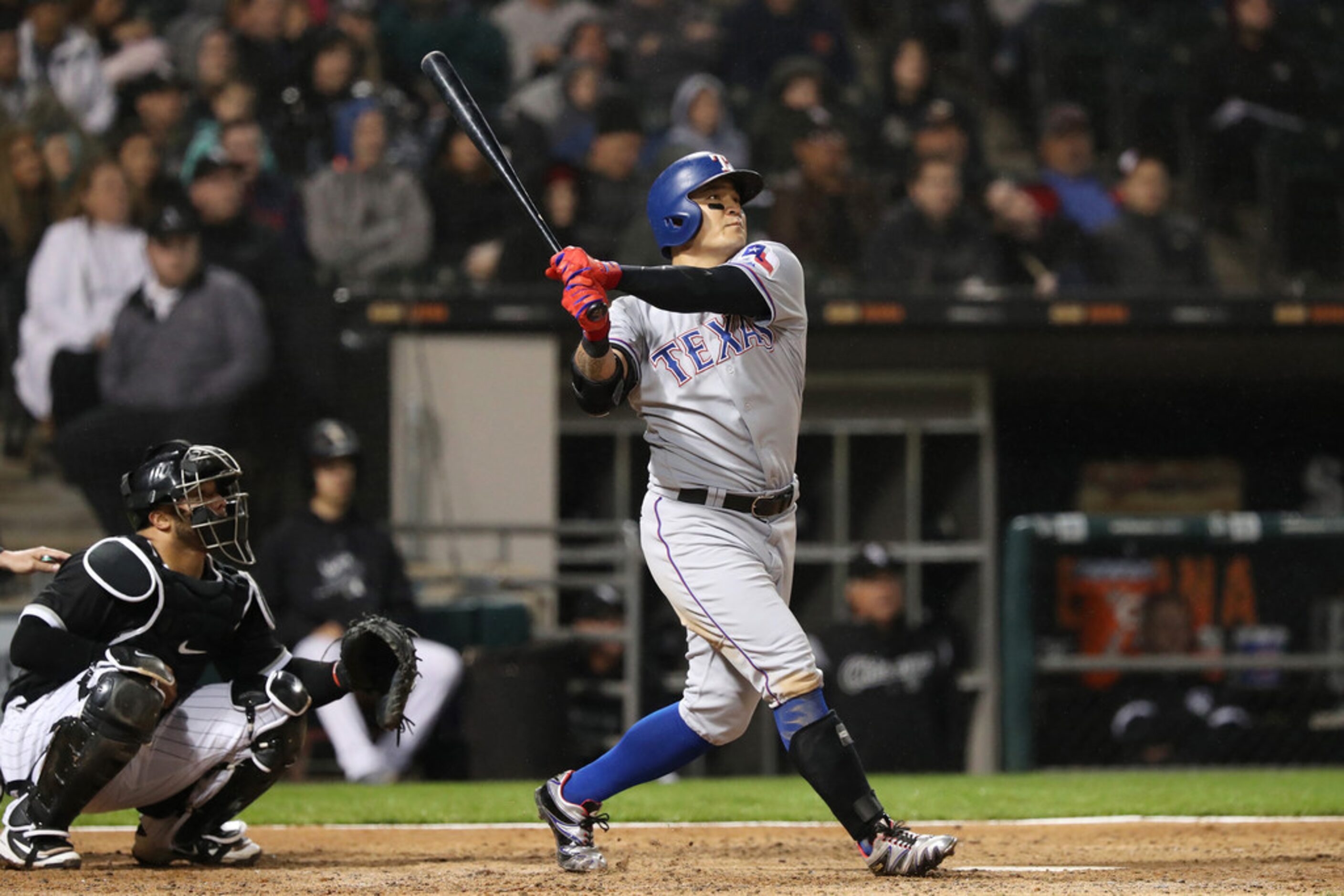 Texas Rangers right fielder Shin-Soo Choo (17) swings through on a grand slam off Chicago...