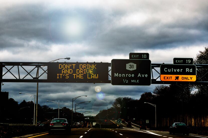 A highway sign that reads "don't drink and drive, it's the law"