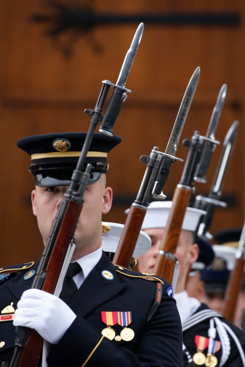 The honor guard marches away after the funeral service for George H.W. Bush, the 41st...