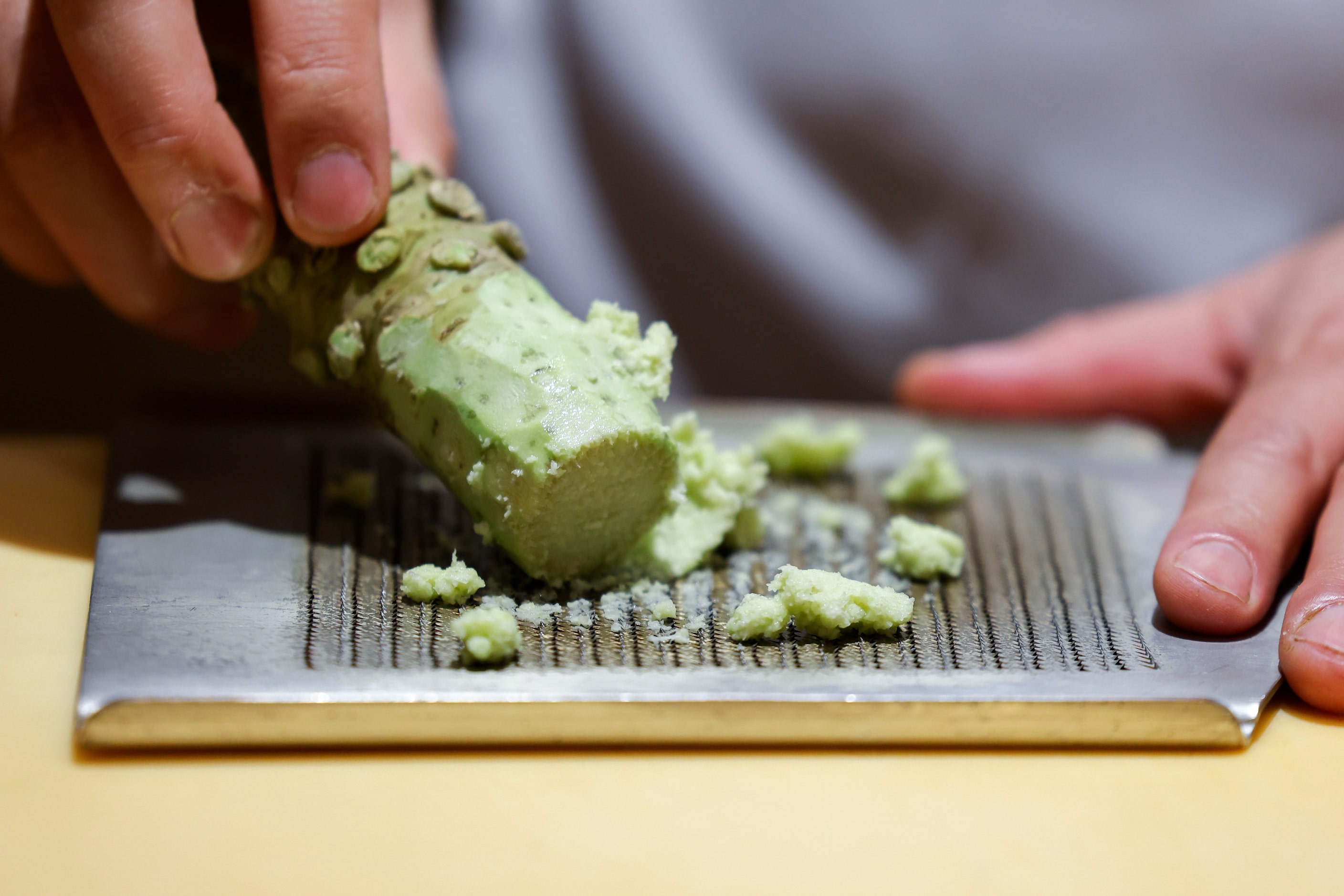 Chef Tatsuya Sekiguchi prepares wasabi ahead of dish serving, on Saturday, Sept. 14, 2024,...