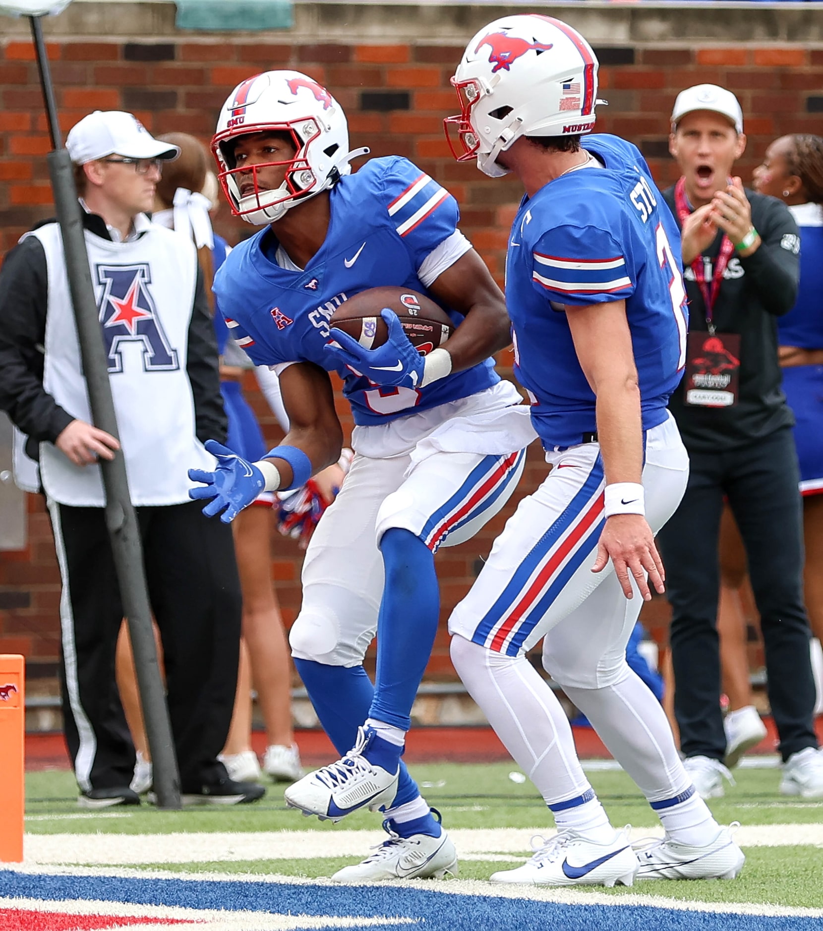 SMU wide receiver Moochie Dixon (left) celebrates with Preston Stone (2) after Dixon's...