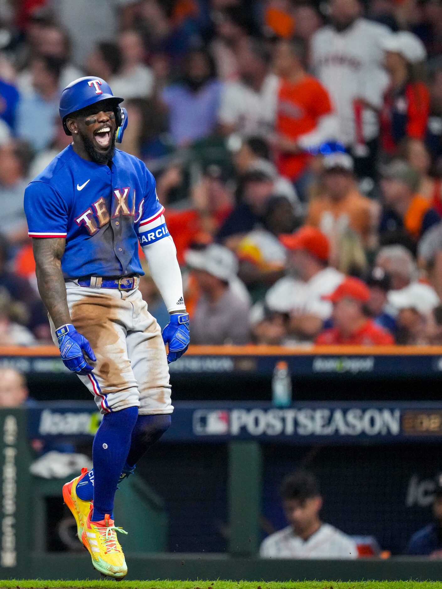 Texas Rangers right fielder Adolis Garcia celebrates after hitting a home run during the...