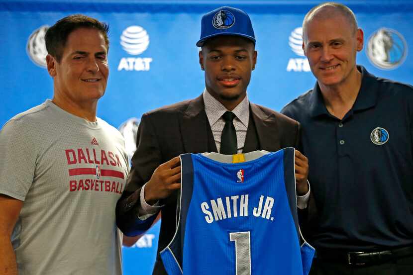 Mavericks first round pick Dennis Smith Jr. (center) poses for a photograph with Head Coach...