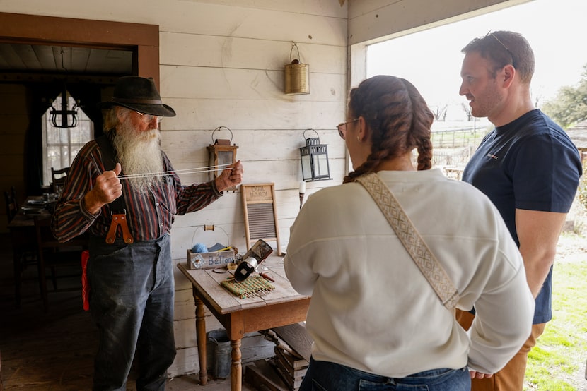 Old City Park historical interpreter Gene Helmick-Richardson (left) talks at the Gano House...