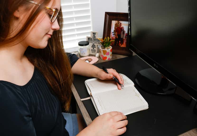 Abigail McGowan is shown with a journal at her home in Denison on June 5, 2023. McGowan...