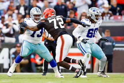 Dallas Cowboys offensive tackle Tyler Smith (73) and offensive tackle Tyler Guyton (60) drop...