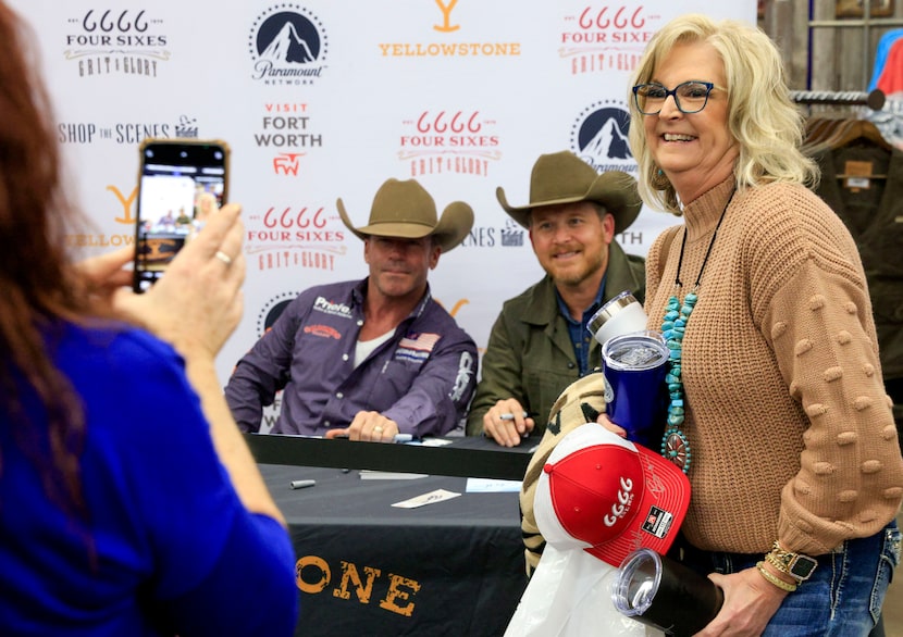 Christine Watters smiles as she poses for a photo with “Yellowstone” creator Taylor Sheridan...