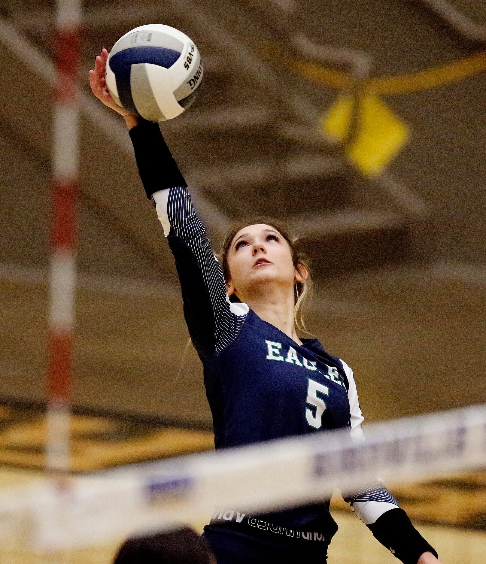 V.R. Eaton High School outside hitter EmilySimmons (5) gets a hit during game two as Keller...