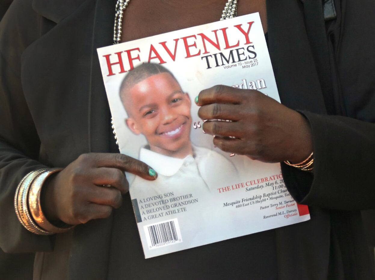 Mourners carried a commemorative program at the funeral service for 15-year-old Jordan...