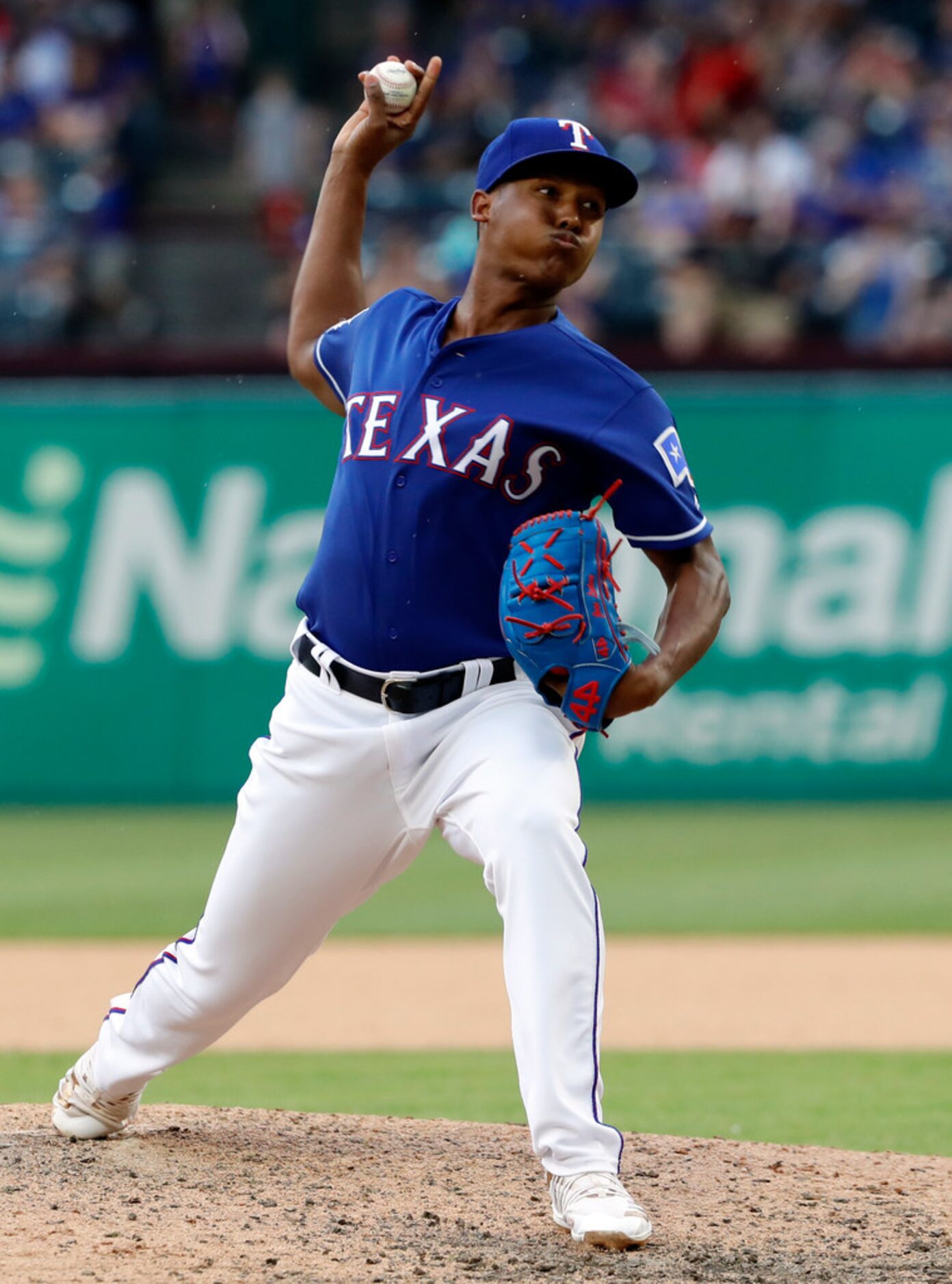 Texas Rangers' Jose Leclerc works against the Kansas City Royals in the seventh inning of a...