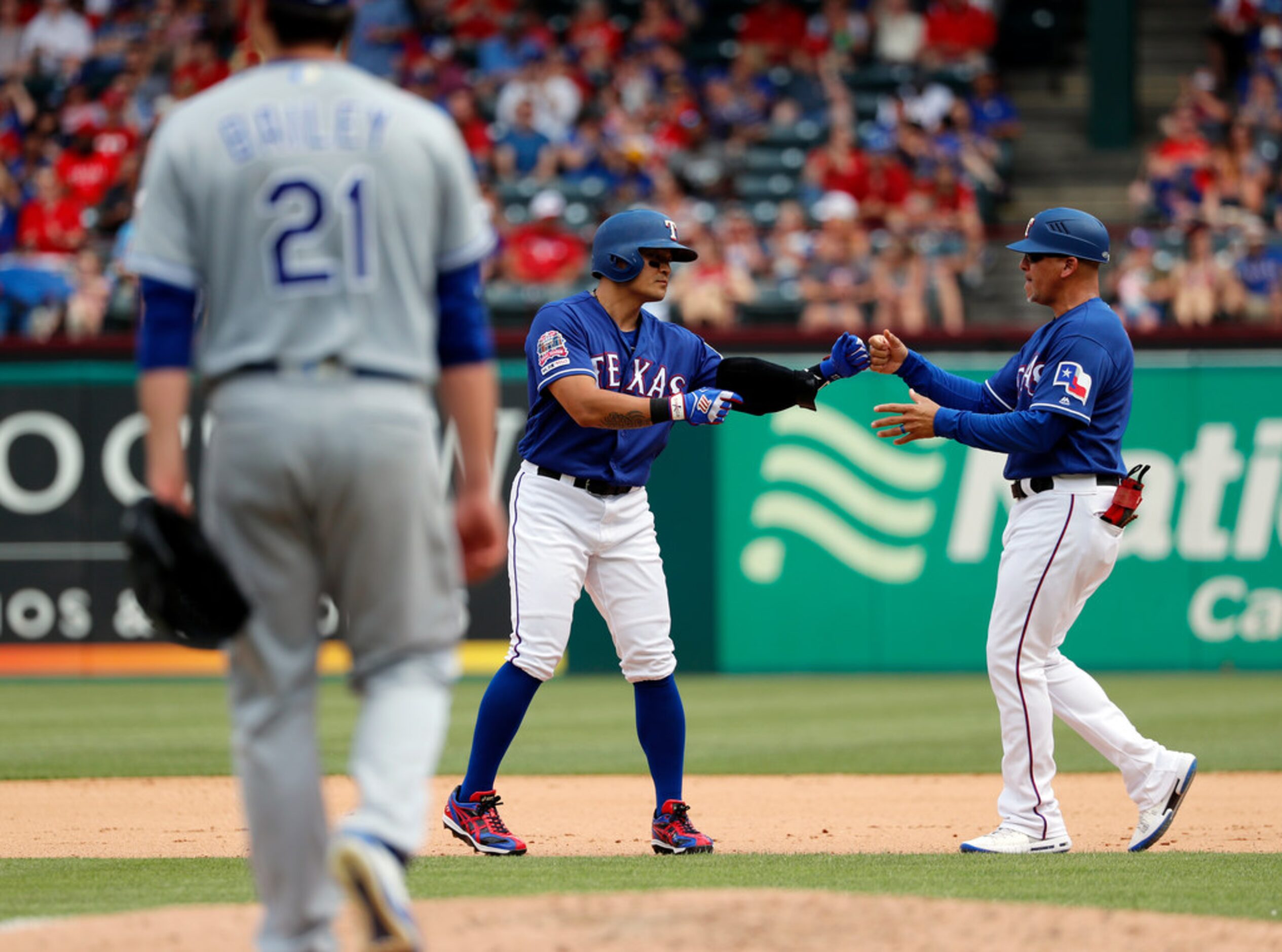 Kansas City Royals' Homer Bailey (21) walks back to the mound as Texas Rangers' Shin-Soo...