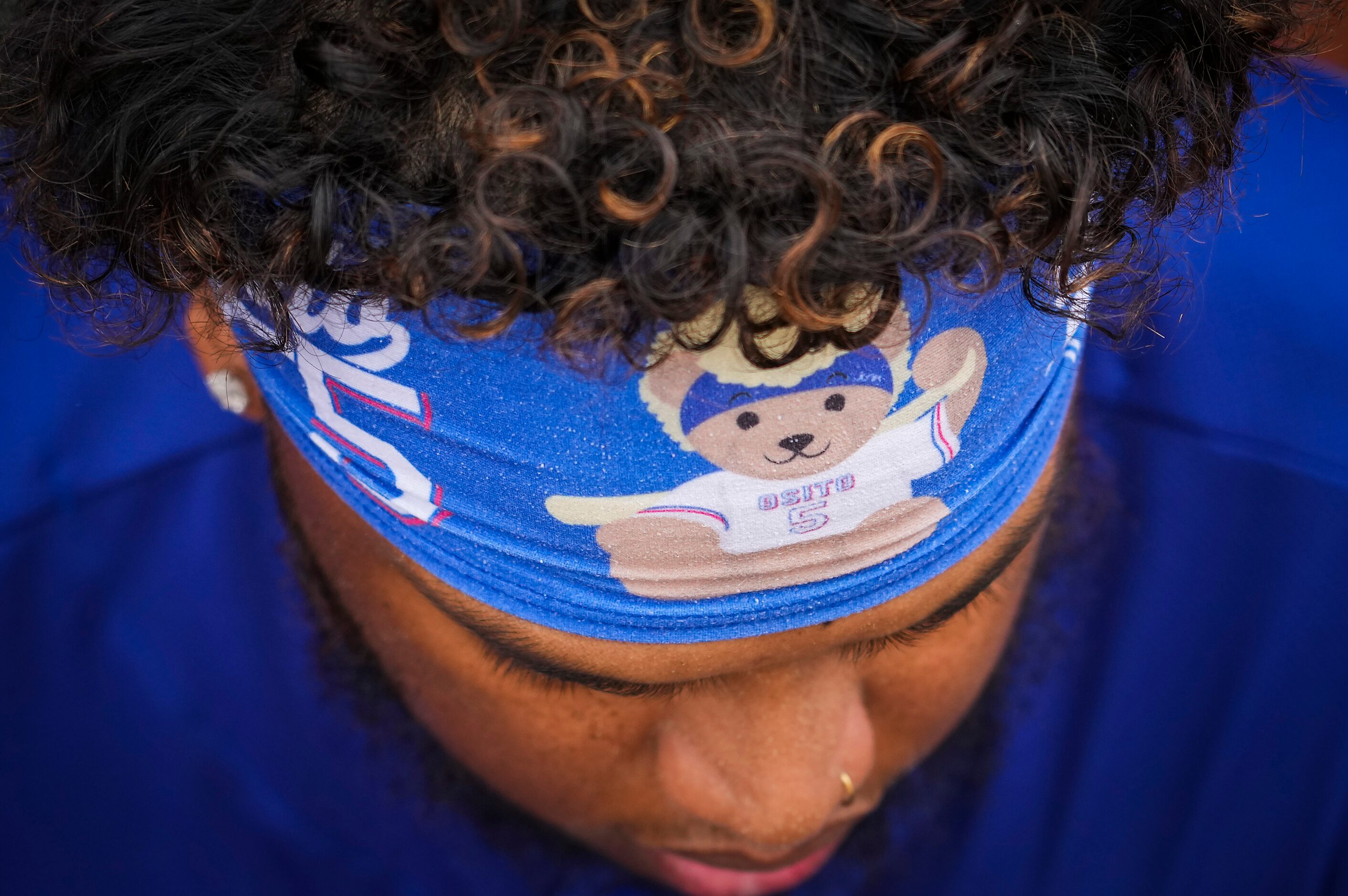 Texas Rangers outfielder Willie Calhoun wears a headband with his nickname “Osito” before a...