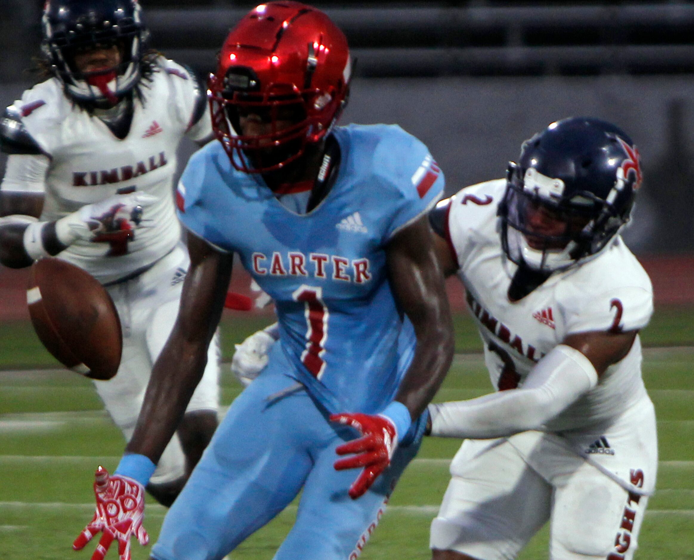 Dallas Kimball defender London Thibodeaux (2), right, reaches in to knock a pass away from...