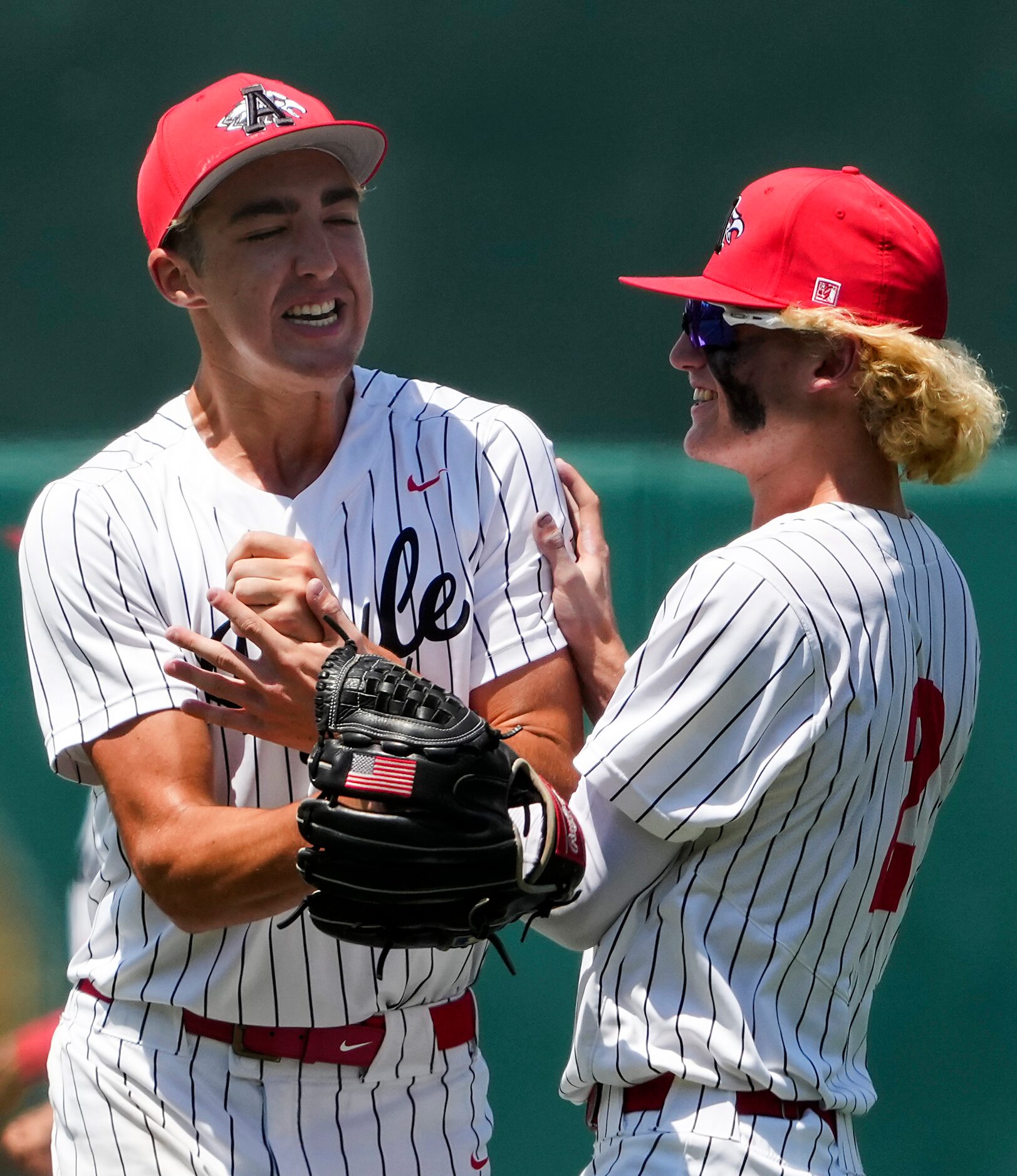 Argyle pitcher Evan Brandt (left) celebrates with first baseman Alex D'Angelo after the...