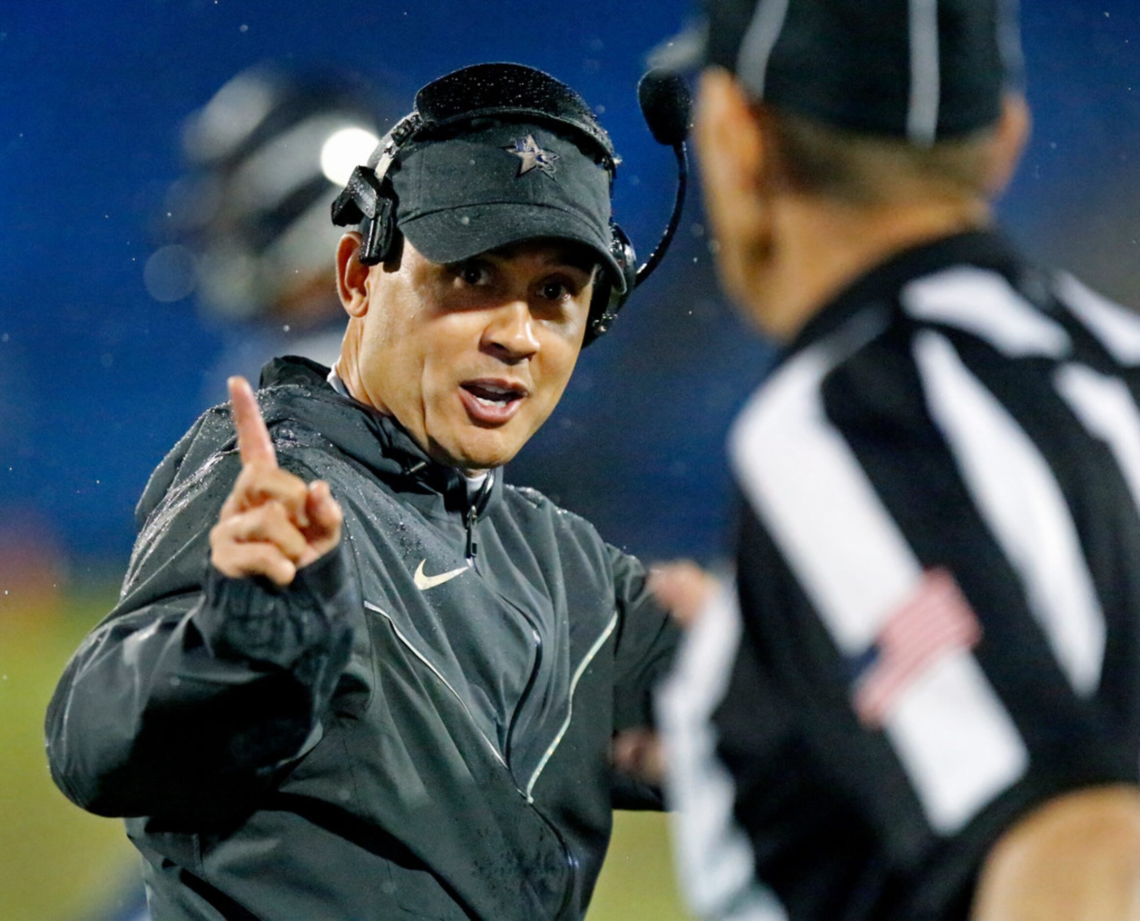 Lone Star High School head coach Jeff Rayburn makes a point to the referee during the first...