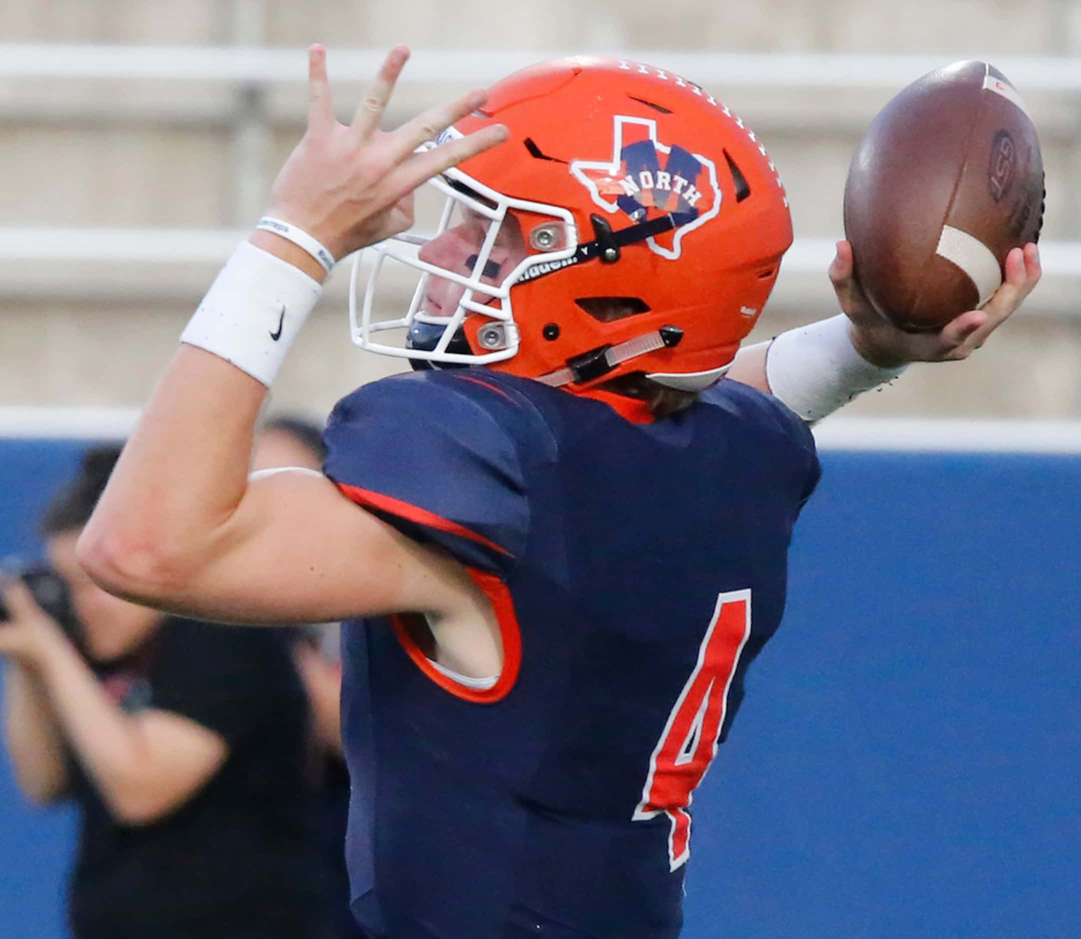 McKinney North High School quarterback Dillon Markiewicz (4) throws a pass during the first...