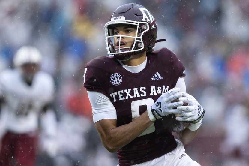 Texas A&M wide receiver Noah Thomas carries the ball in the first half of an NCAA college...
