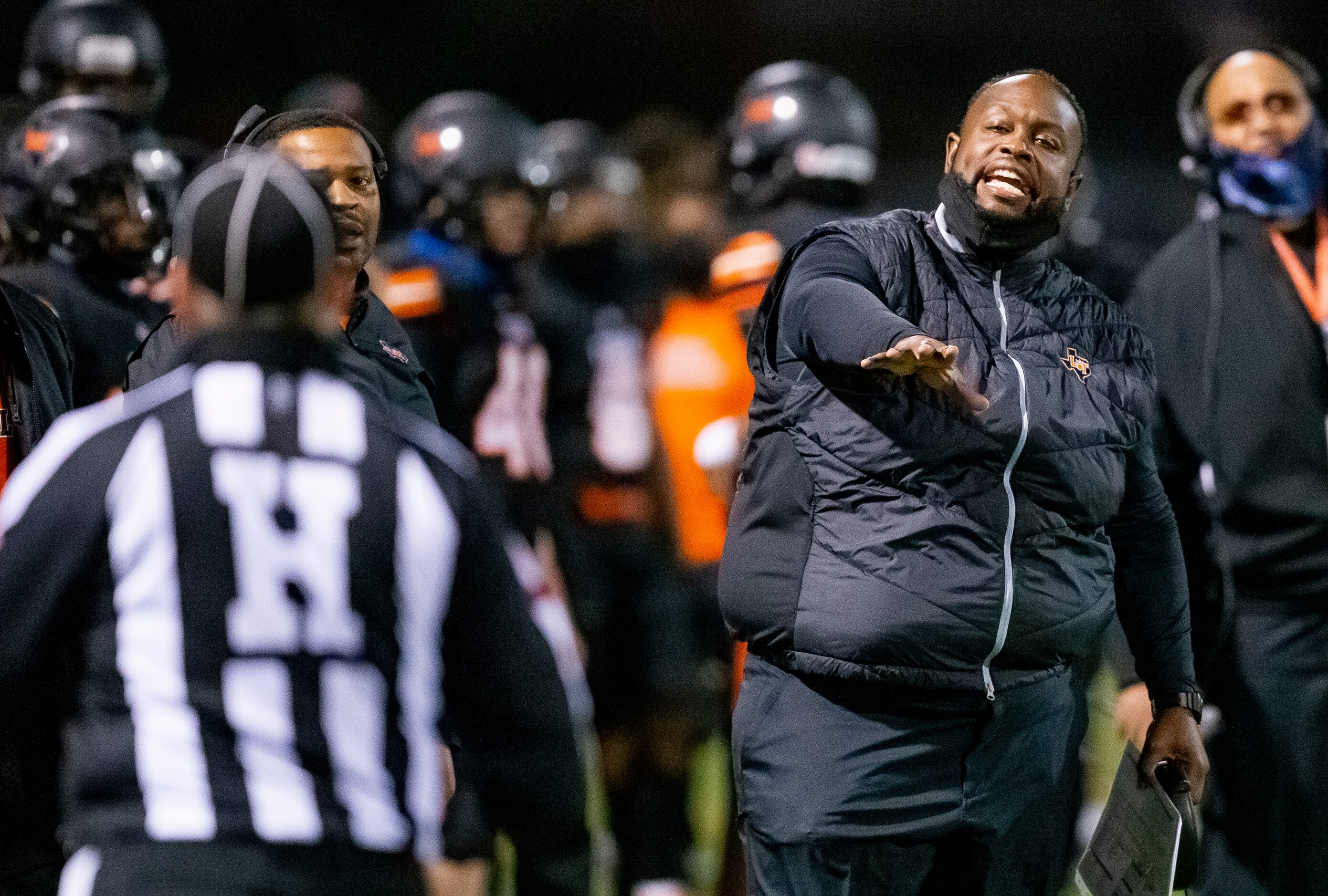 Lancaster head coach Chris Gilbert argues a call during the first half of a class 5A...