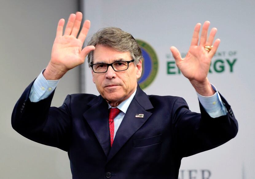 Energy Secretary Rick Perry waved after delivering a message to the media July 13 in Mexico...