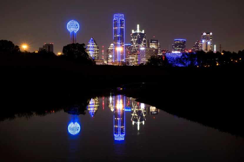The downtown Dallas skyline lights up in blue in recognition of National Police Week on May...
