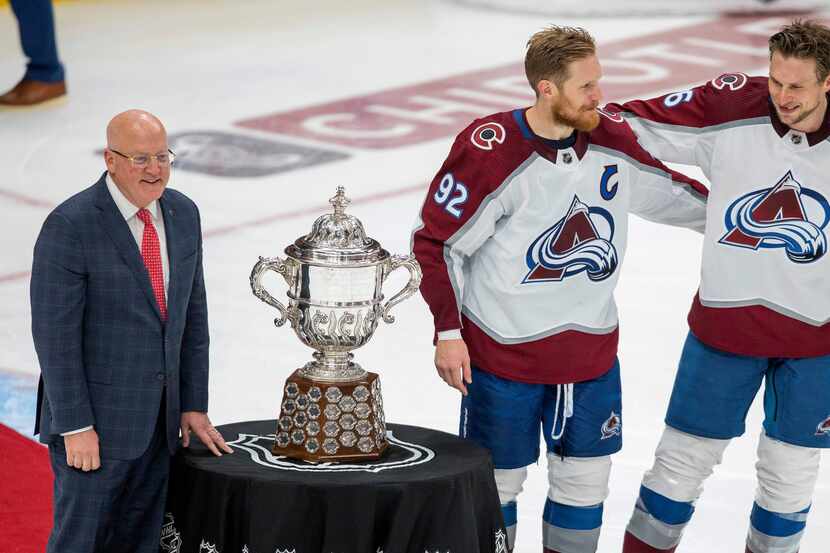 Colorado Avalanche's Gabriel Landeskog (92) and Erik Johnson (6) stand with the Campbell...