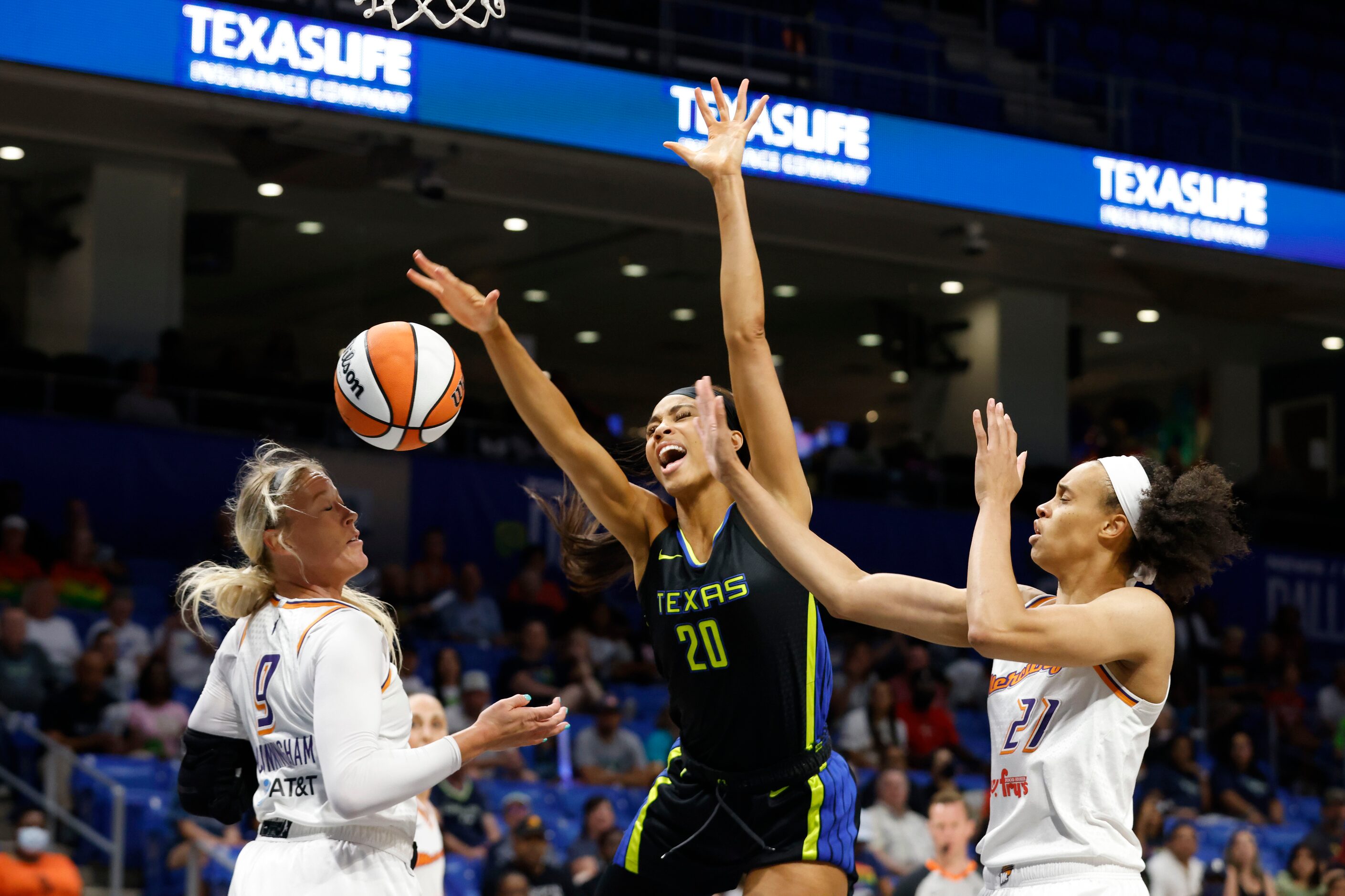 Dallas Wings forward Isabelle Harrison (20) is fouled by Phoenix Mercury forward Brianna...