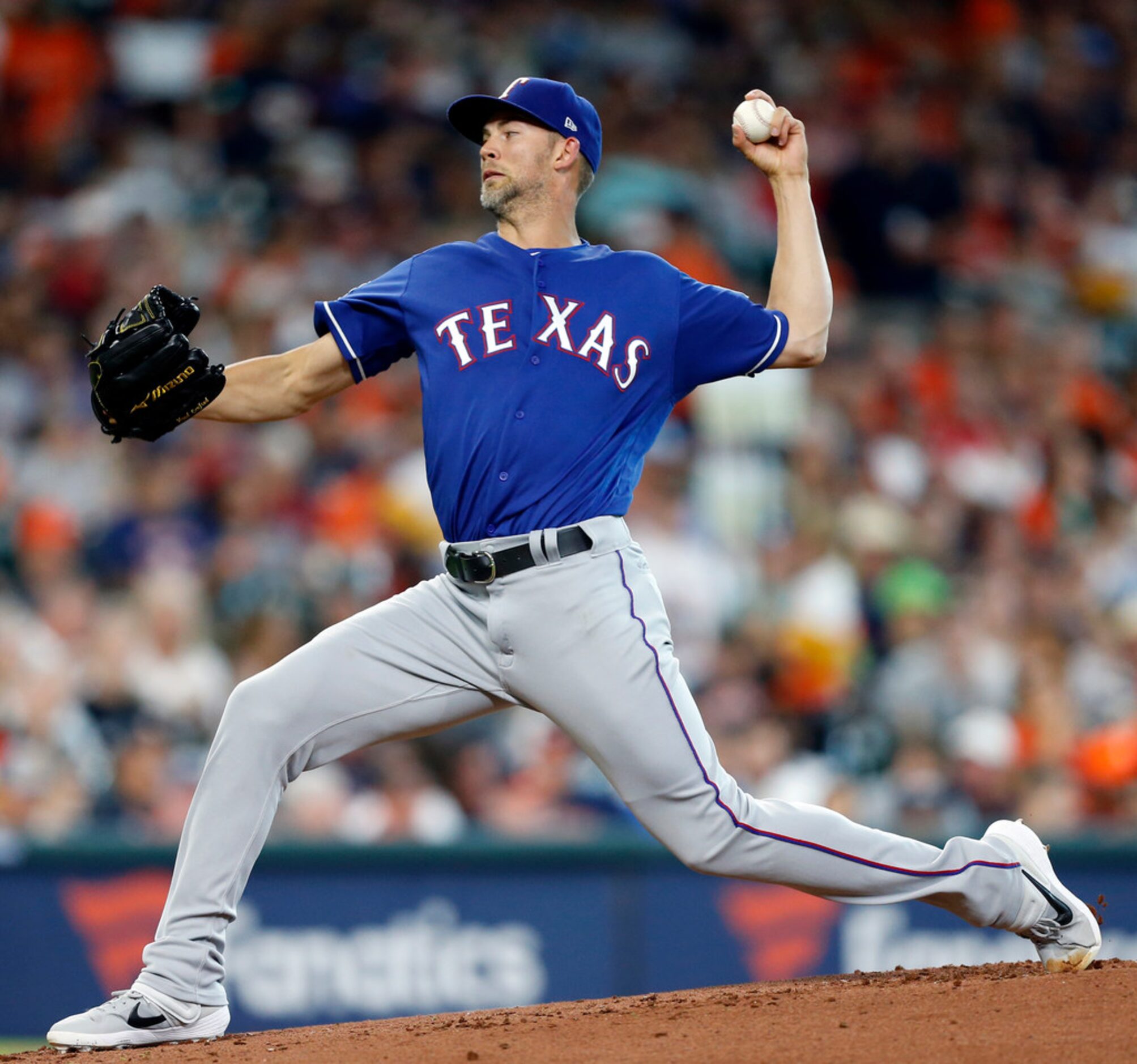 HOUSTON, TEXAS - JULY 19: Mike Minor #23 of the Texas Rangers pitches in the first inning...