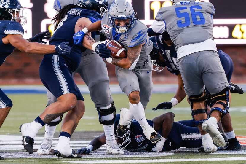 Memphis Tigers running back Jevyon Ducker (8) runs with the football during the fourth...