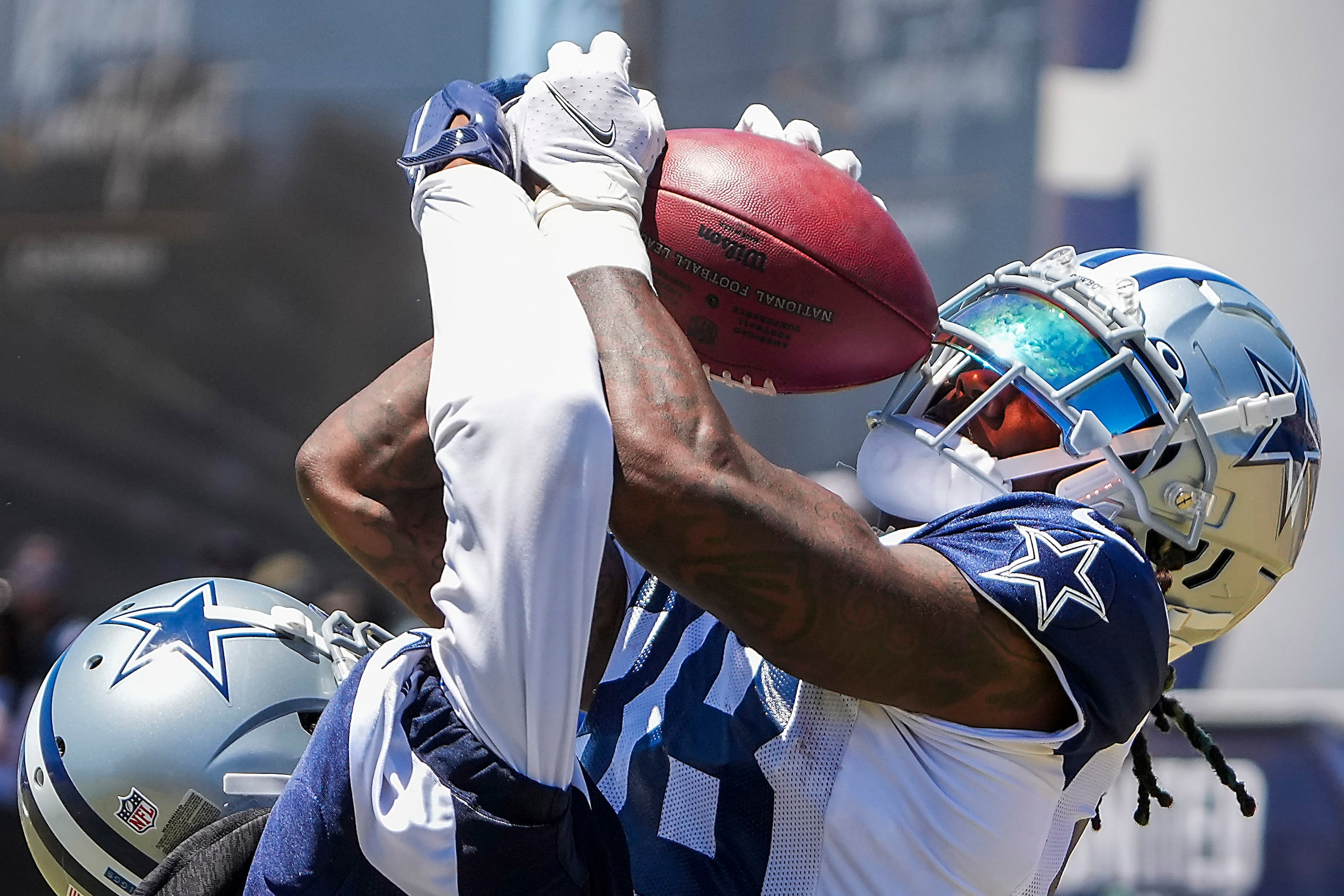 Dallas Cowboys wide receiver CeeDee Lamb (88) catches a touchdown pass as cornerback Trevon...