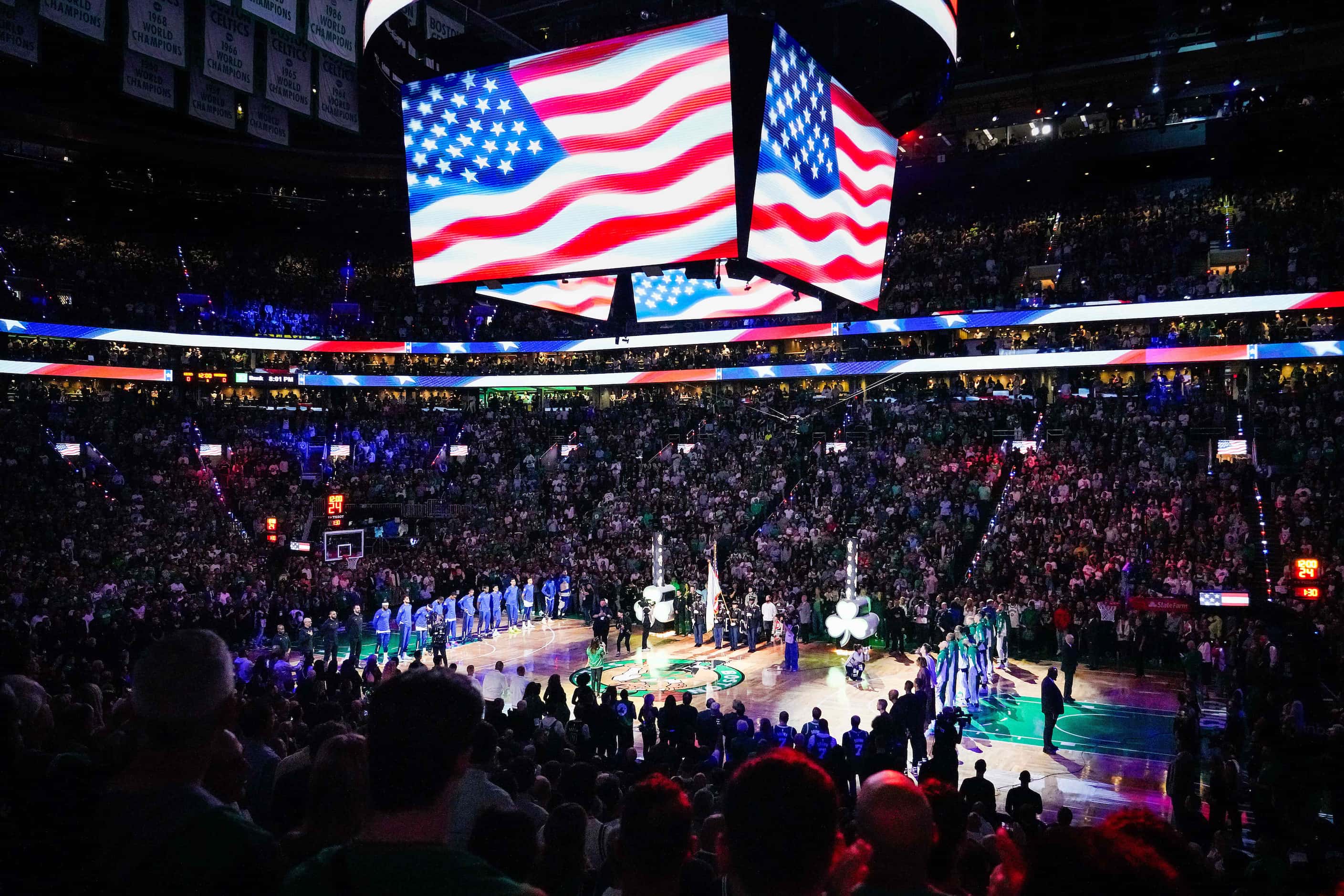 Players stand for the national anthem before Game 2 of the NBA Finals between the Dallas...