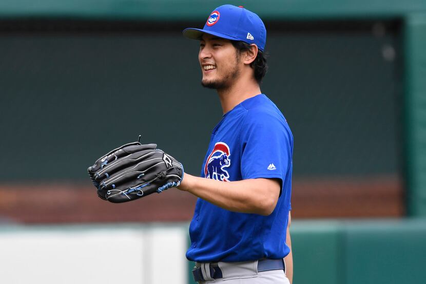 Chicago Cubs pitcher Yu Darvish throws during batting practice prior to a baseball game...