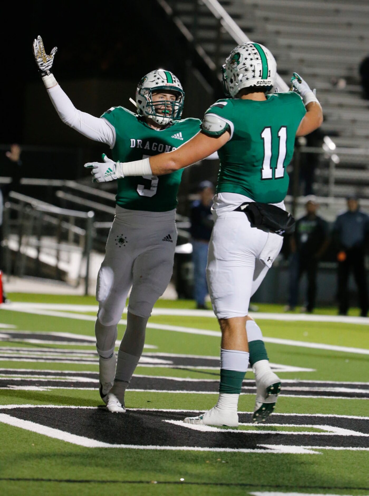 Southlake's Wills Meyer (5) celebrates his touchdown against Eaton with Blake Smith (11)...