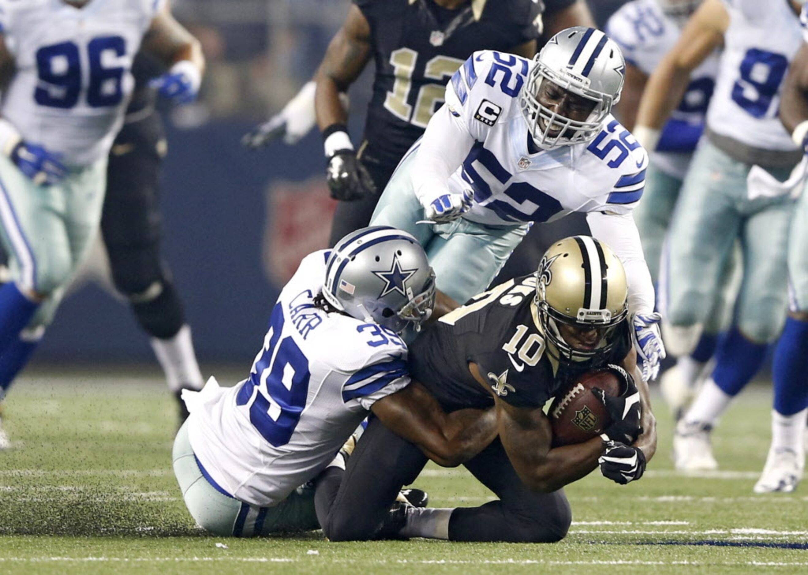 New Orleans Saints wide receiver Brandin Cooks (10) is brought down by Dallas Cowboys...