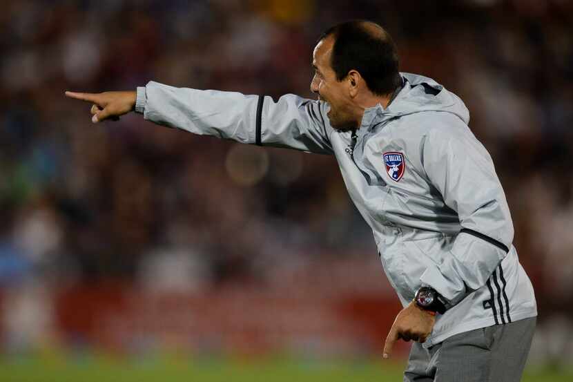 COMMERCE CITY, CO - JULY 23: Oscar Pareja, head coach of FC Dallas, works on the sideline...