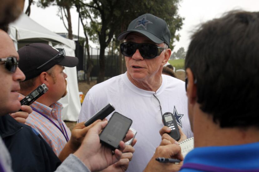 Dallas Cowboys owner Jerry Jones talks with the media during the afternoon practice at...