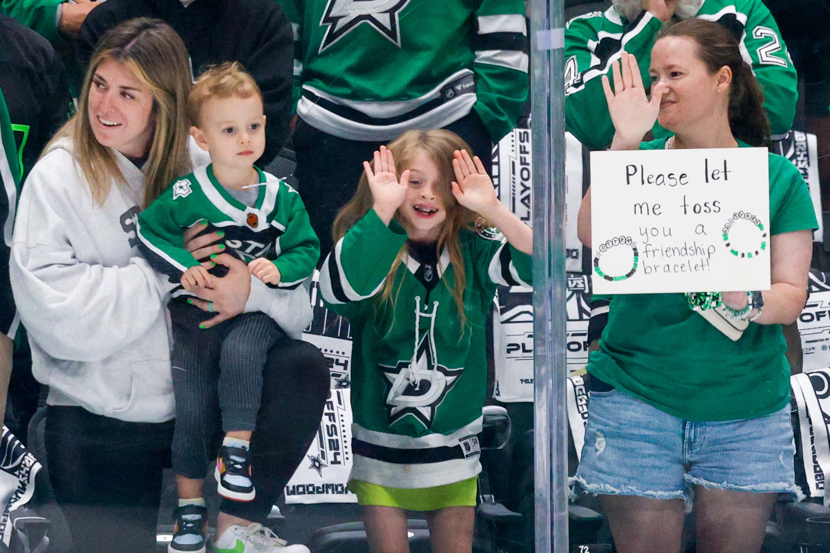 A young fan bangs on the glass as the Dallas Stars warmup before Game 2 of the NHL hockey...