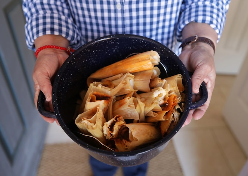 Mely Martinez shows off her homemade tamales at her home in Frisco