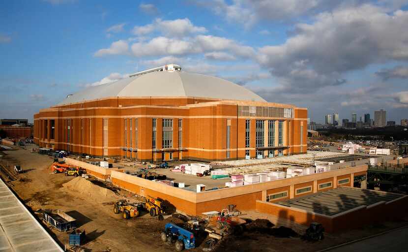 The Fort Worth skyline is visible as the new Dickies Arena is under construction along...