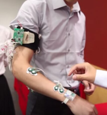  The wearable Sign Language Recognition system worn by Zhongiun Tian uses sensors to capture...