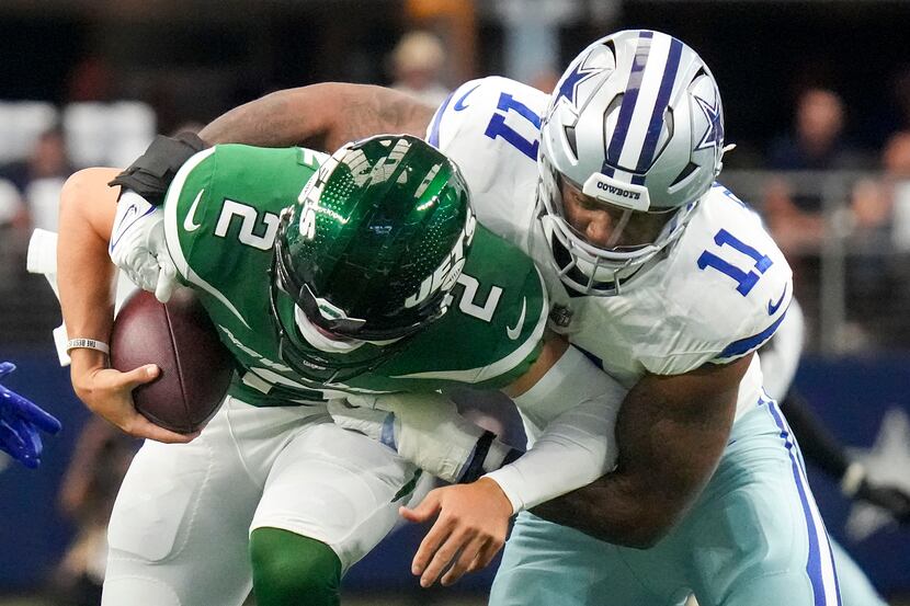 New York Jets quarterback Zach Wilson (2) is sacked by Dallas Cowboys linebacker Micah...