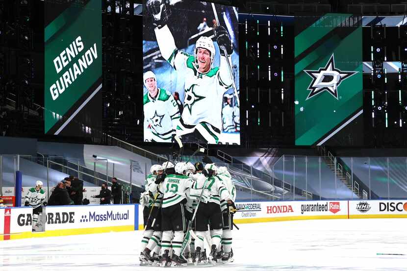 A general view is seen at center ice of Dallas Stars players celebrating after Denis...