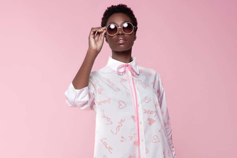 A model wearing designer Andre Yabin's white-and-pink Love Shirt Dress.
